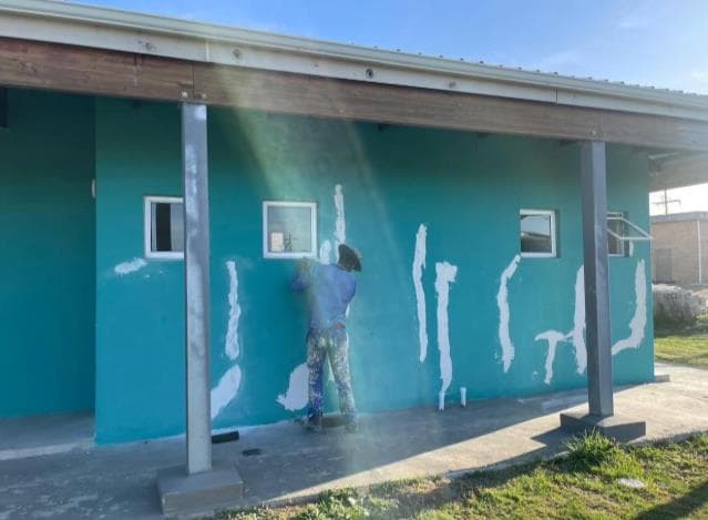 Professional hair stylist meticulously working on a client's hair.