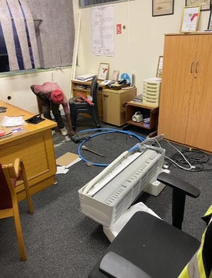Modern hair products on a shelf.